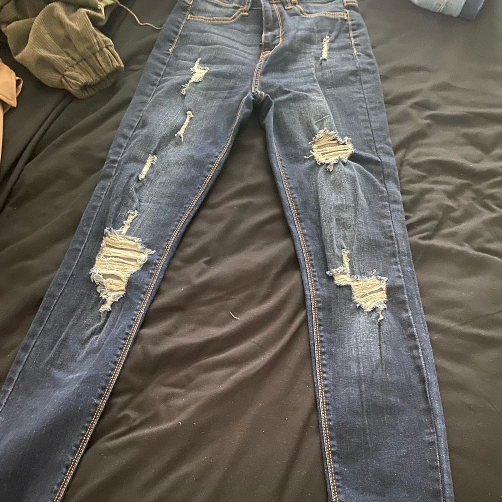 Distressed denim jeans